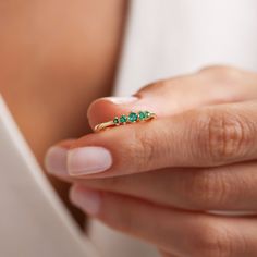 Your Minimalist Emerald Ring is stylish, dainty and pretty ideal for everyday use. Details of solid gold handmade Dainty Green Gemstone Jewelry are very eye-catching. It is a great gift for your loved ones. This jewelry will be an indispensable piece of yours. This meaningful May Birthstone Ring with high quality handwork will be a legacy you can leave to your family its.  * 5 Stone Emerald Ring Details * Material / Gold Kt:  14K (585), 18K (750), 8K (333) * Available Gold Colors: Yellow Gold, W Emerald Engagement Ring Simple, Emerald Ring Design, May Birthstone Rings, Gold Stacking Ring, Green Emerald Ring, Simple Engagement Rings, Gold Colors, May Birthstone, Gold Ring Stack