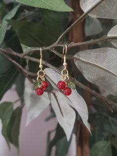 These cute cherry earrings are handmade with love in Finland. The hooks are made of 18K gold-plated surgical stainless steel so they are suitable for sensitive skin. Manufacturer's proof: Terhentuuli Palvelut Oy Artturintie 6 B 18 36220 Kangasala Finland https://www.etsy.com/shop/terhentuuli Red Clip-on Earrings As Gift, Cherry Colored Round Earrings For Gift, Cherry Round Earrings For Gift, Cute Red Dangle Jewelry, Cute Handmade Red Earrings, Red Hypoallergenic Dangle Earrings, Hypoallergenic Red Dangle Earrings, Cherry Colored Drop Earrings With Ear Wire, Nickel Free Cherry Colored Earrings For Gift