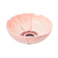 a pink flower shaped bowl on a white background