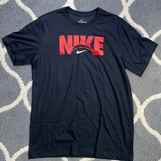 Bnwt. Men’s Large Nike T-Shirt. Thanks! Black Nike Cotton T-shirt, Nike Black T-shirt With Letter Print, Black Nike T-shirt With Letter Print, Nike Black Shirt With Letter Print, Nike Black Cotton T-shirt, Nike Black Tops With Screen Print, Nike Tshirt, Nike Shirts, Nike Black