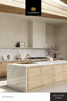 a kitchen with white marble counter tops and wooden cabinetry, along with an overhead window