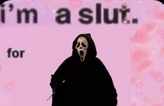 a person in a black hooded suit with a knife and skull on it's face