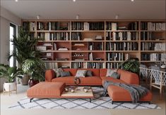 a living room filled with lots of bookshelves next to a couch and table