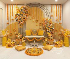 a room decorated with yellow and orange flowers