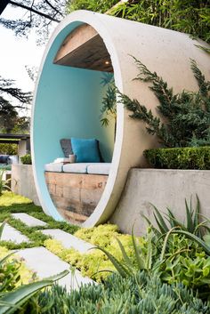 an outdoor room with a couch in the middle