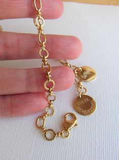 Personalized Charm Bracelet, Gold Engraved Bracelet, Mothers Day Gift, Mother of the Bride Gift, Best Friend Gift, Keepsake Bracelet, Gift ❤️This classic keepsake gold bracelet features a fancy and unique chain of polished oval rings and textured round rings (ovals measure 5.7mm, rounds measure 6mm). This is a beautiful quality made 24kt gold overlay chain that is double sided. I have adorned this fabulous bracelet with up to ten engraved 1/2 inch 14kt gold filled discs. The price varies based o Affordable Engraved Charm Bracelet For Mother's Day, Engraved Round Charm Bracelet As Gift, Gold Bracelet For Anniversary Gift, Etched Round Bracelet As Gift, Elegant Stamped Gold Bracelets, Engraved Gold Charm Bracelet For Birthday Gift, Engraved Yellow Gold Charm Bracelet As Gift, Personalized Etched Gold Jewelry Gift, Elegant Name Bracelet With Lobster Clasp As Gift