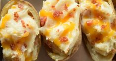 baked potatoes with cheese and bacon on them