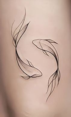 an artistic drawing of two goldfishs on the back of a woman's stomach