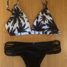 Black An White Bikini Set New Never Worn Both Pieces Size Small. Very Cute Suit! Black Tropical Swimwear For Beach Party, Tropical Black Triangle Top Swimwear, Black Strappy Tankini For Poolside, Black Triangle Top Swimwear With Cutout, Black Cutout Triangle Top Swimwear, Black Strappy Swimwear For Beach Party, Black Triangle Top Tankini For Beach Party, Coconut Tree, Palm Tree