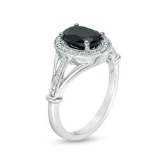 a black and white diamond ring on a white background