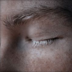 the eyes of a person with long eyelashes