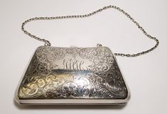 Ca 1855-1892 Vintage William B. Kerr Silver Monogram Scrolling Floral Compact with Chain Embrace the elegance of a bygone era with this exquisite Ca 1855-1892 Vintage Sterling Silver Monogram Scrolling Floral Compact. Crafted with meticulous artistry and adorned with intricate scrolling florals, this compact bears the sterling silver hallmark, weighing an impressive 110.78dwt. Previously under the renowned William B. Kerr & Co., celebrated for their Art Nouveau jewelry, holloware, and vanity ite Seahorse Design, Silver Wallet, Silver Pen, Silver Monogram, Small Coin Purse, Floral Purse, Card Holder Case, Art Nouveau Jewelry, Antiques For Sale