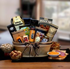 a basket filled with snacks and crackers on top of a table