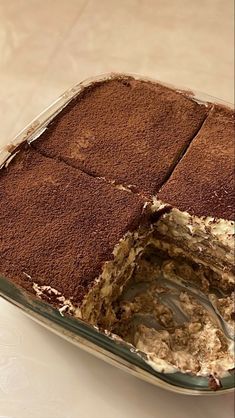 a cake with chocolate frosting in a pan