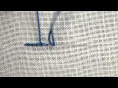 the blue thread has been stitched into the fabric