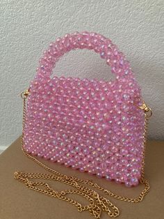 Handmade Beaded Purse with Removable Gold Chain All bags are 100% handmade. The purse will fit your phone, small wallet, keys. Dimensions H: 5,5 in H: ~8 in with Handle W: 7,5 in D: 2 in Gold chain length: 50 in The bag will be kindly packaged to ensure it is delivered to you safely. Cheap Pink Beaded Bags, Pink Handheld Phone Bag Gift, Pink Handheld Phone Bag For Gift, Party Beaded Rectangular Phone Bag, Beaded Rectangular Phone Bag For Parties, Rectangular Beaded Phone Bag For Parties, Party Rectangular Beaded Phone Bag, Pearl Purse, Hand Beaded Bag