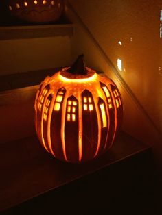 a carved pumpkin sitting on top of a table