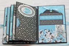 the inside of a handmade card with blue and black designs on it, which is folded in half