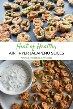 an air fryer filled with fried vegetables next to a bowl of ranch dressing and the words, hint of healthy air fryer jalapeno slices