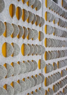 the wall is made up of circles and yellow dots on it's sides,