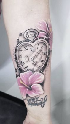 a woman's leg with a clock and flower tattoo on the side of her arm