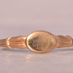 The Baba: Child's Antique Yellow Gold Signet Ring. The Ring Features An Oval Signet Center With A Ridged Upper Shank To Complete The Look. The Ring Is Crafted In Yellow Gold And Is Currently A Finger Size 3.25 Yet Can Be Adjusted To Any Finger Size For An Additional Charge On Request. Antique Yellow Gold Signet Ring, Antique Gold Ceremonial Signet Ring, Antique Red Signet Ring In 14k Gold, Antique 14k Gold Signet Ring With Hallmarks, Classic Yellow Hallmarked Signet Ring, Kids Accessories Jewelry, Gold Signet Ring, Signet Ring, Kids Accessories