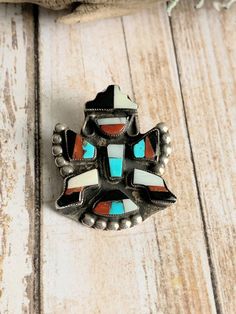 "This is a gorgeous vintage Zuni Knife Wing Pin . It's handcrafted using turquoise, coral, onyx, Mop & bezel set in Sterling silver. It's in excellent pre-owned condition measuring 1.25\"x1\" & 6.84 grams. This beautiful old Kachina Pin is unsigned, as was the case in the 60's & before. It will be a nice addition to any jewelry collection! Please view all photos carefully! Welcome to NorthWestTradingCo." Handmade Bohemian Brooches For Collectors, Unique Handmade Turquoise Brooch, Handmade Turquoise Brooches For Collectible, Unique Handmade Turquoise Brooches, Handmade Vintage Turquoise Brooches, Antique Knife, Vintage Knife, Inlay Jewelry, Zuni Jewelry