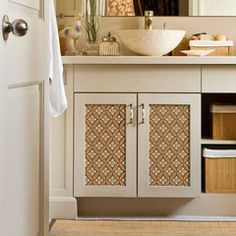 a bathroom with a sink, mirror and cabinet in the corner next to a door