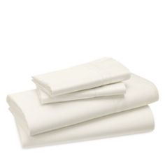 white sheets folded on top of each other