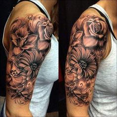 a woman's half sleeve with flowers on her left arm and an open shoulder