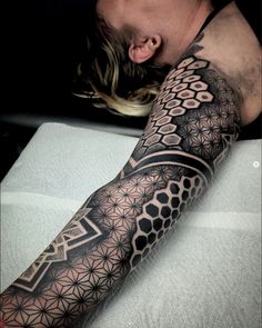 a man with a tattoo on his arm