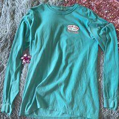 - Perfect Summer Long Sleeve Top ! - Comfy Breathable Material - Beautiful Dark Blue/Green Color With Iconic Logo On Front And Back ! -Never Worn Before! Ready For A New Home ! Lol Light Blue Long Sleeve Tops For Beach Season, Blue Long Sleeve Tops For Beach Season, Turquoise Long Sleeve Tops For Vacation, Turquoise Long Sleeve Beach Top, Long Sleeve Turquoise Tops For Vacation, Casual Turquoise Top For Beach Season, Ron Jon Surf Shop Shirt, Ron Johns Surf Shop, Lululemon Clothes