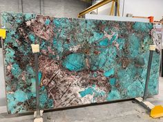 a large slab of blue and brown marble