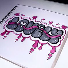 a notebook with graffiti written on it and pink ribbon around the word'love '