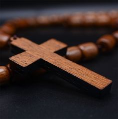 ♥ SOLID WOOD ROSARY - Solid, genuine brown jatoba wood rosary necklace with cross crucifix ♥ BEADED - 9 x 8 Solid Brown Jatoba Oval Shape Beads. ♥ NECKLACE FOR MEN - Can be used around neck or for praying. ♥ LENGHT - 19.5 inches. ♥ HANDCRAFTED - Made in Brazil by artisans with love and devotion. WARNING: CHOKING HAZARD -- Small parts. Not for children under 3 yrs. Brown Cross Rosary In Spiritual Style, Beads Necklace For Men, Spiritual Brown Cross Necklace, Brown Spiritual Rosary With Cross, Brown Cross Shaped Spiritual Rosary, Traditional Handmade Brown Rosary, Brown Rosary With 8mm Beads And Cross Shape, Brown Wooden Beaded Cross Rosary, Adjustable Brown Wooden Beads Rosary