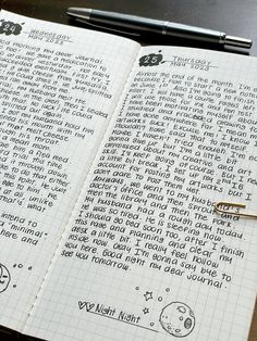 an open notebook with writing on it next to a pen