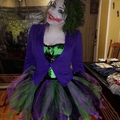 a woman dressed up as the joker for halloween