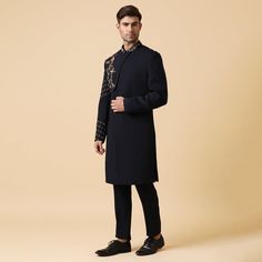 A deep blue indo-western set with embroidery of flowers on chest overlapping panel and sleeve with same fabric pants. Perfect for a groom for pre-events or for a formal party. Delivery Period: 20 Days Elegant Unstitched Kurta With Embroidered Sleeves, Elegant Traditional Wear With Floral Embroidery For Reception, Elegant Designer Wear Sherwani With Straight Kurta, Elegant Straight Kurta Bandhgala For Party, Elegant Embroidered Sherwani Straight Kurta, Elegant Embroidered Sleeves Kurta For Eid, Formal Unstitched Kurta With Embroidered Sleeves, Formal Party Wear Kurta With Zari Work, Elegant Designer Kurta With Embroidered Sleeves