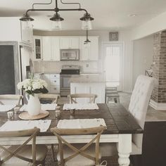 a dining room table is set with placemats