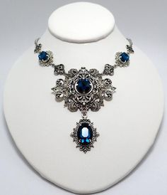 This is a new handmade necklace. It is made with antiqued silver plated filigrees, accented with high quality DARK TEAL glass rhinestones. Decorated portion is 7" wide and 3 1/4" tall in the center. Necklace is adjustable 15-18" with a lobster clasp and chain extender. If you would like a different length, please send us a message. Antique Silver Victorian Metal Necklace, Victorian Antique Silver Metal Necklace, Victorian Antique Silver Necklace, Gothic Antique Silver Jewelry With Intricate Design, Gothic Metal Necklace With Intricate Design, Gothic Metal Jewelry With Filigree, Gothic Filigree Metal Jewelry, Antique Silver Gothic Jewelry With Filigree, Antique Silver Gothic Filigree Jewelry