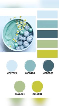 a bowl filled with green eggs next to some blue and yellow paint swatches on a white surface