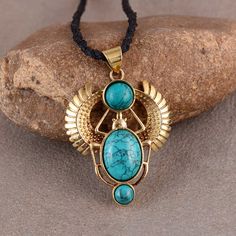 Gold Turquoise Scarab Pendent, Third Eye, Boho, Inca, Ethnic, Illuminati, Gift for her, Best Friend Gift, Mansoon Offer. ❥turquoise Gemstone Benefits : This sacred stone is believed to act as a talisman for travelers, a stone of prophecy, and an ultimate gift for lovers. It opens the Heart and Sacral chakra in the body to increase the psychic abilities and stimulate inner growth with intuition for its possessor. ❥ The brass metal will develop a nice antique color over time. So, I suggest cleanin Golden Scarab, Scarab Necklace, Character Clothing, Egyptian Scarab, Talisman Jewelry, Egyptian Revival, Necklace Turquoise, Trifle, Turquoise Pendant