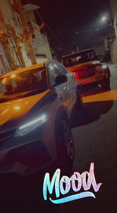 two cars parked in front of each other on a street at night with the word moon written across it