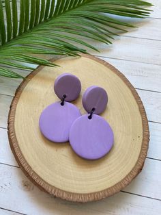 These lovely light purple, clay earrings are each one of a kind....hand crafted in NYC (by me!)  These fun statement earrings are made from polymer clay which is very lightweight. They are made with silver plated posts to avoid irritation and come with clear rubber earring backs. When you buy handmade products you support artists designers and creators like me! My products are all handmade and NOT manufactured. Gift packaging and FREE shipping included! If you have any questions about these funky earrings please send me a message! I'll be happy to answer you. Purple Dangle Polymer Clay Jewelry, Purple Hues Polymer Clay Earrings, Lilac Clay Earrings, Handmade Purple Polymer Clay Earrings, Artistic Hand-painted Purple Earrings, Funky Earrings, Purple Earrings, Support Artists, Buy Handmade