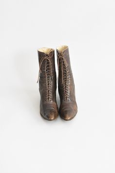 "Antique boots c. 1900-1910. Umber supple brown leather. Pointed toes with petite punched out detailing. Metal grommets for laces. Two inch wooden heels with rubber bottoms. Lined in canvas. A lovely example of early 20th century walking shoes. Condition | Overall age related wear and incomplete/ brittle laces. Parts of the soles are lifting at edges. refer to photos & request further photos if needed. Measurements ✂--- Best fit | US 6 1/2\" ** please refer to measurements Outer length | 9.7 Vintage Lace-up Boots With Cap Toe And Leather Sole, Vintage Lace-up Cap Toe Boots With Leather Sole, Vintage Lace-up Boots With Pointed Toe And Leather Sole, Victorian Boots With Leather Sole And Round Toe, Vintage Brown Lace-up Heeled Boots, Vintage High Ankle Brown Heeled Boots, Vintage Brown High Ankle Heeled Boots, Victorian Leather Boots With Round Toe, Vintage Brown Heeled Boots With Leather Sole