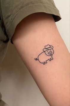 a person with a small tattoo on their arm