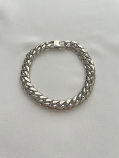 The Augusta Bracelet. Chunky curb chain with a spring clasp. Available in two sizes. The bracelet is available in two lengths. The 9" bracelet is 1/2" wide The 8.5" bracelet is 1/4" wide Spring clasp in Stainless steel. Tarnish resistant