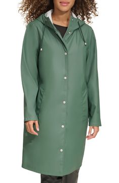 Durable and versatile, this hooded rain jacket features a drawstring hood, covered zipper placket and welt pockets to keep your hands warm and dry. 38 1/2" length Drawstring hood Water-resistant 100% polyurethane Machine wash, tumble dry Imported Fall Travel Raincoat With Drawstring Hood, Hooded Raincoat For Travel, Hooded Raincoat With Drawstring Hood For Travel, Travel Raincoat With Drawstring Hood, Casual Hooded Raincoat For Travel, Hooded Weatherproof Parka For Spring, Hooded Raincoat With Double-lined Hood, Solid Raincoat With Drawstring Hood For Rainy Weather, Solid Raincoat With Drawstring Hood