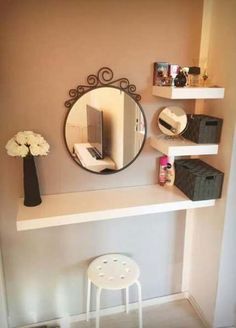 there is a mirror and some shelves on the wall