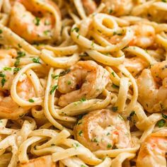 pasta with shrimp and parsley in a pan ready to be served on the table